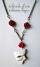 Phantom Mask and 5 Roses antique gold necklace