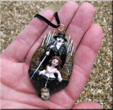 Phantom Boat Scene Pendant is just under 3 inches tall.