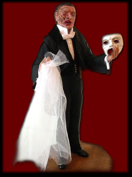 Unmasked at last, the Phantom holds the veil for Christine. 10 inch clay version